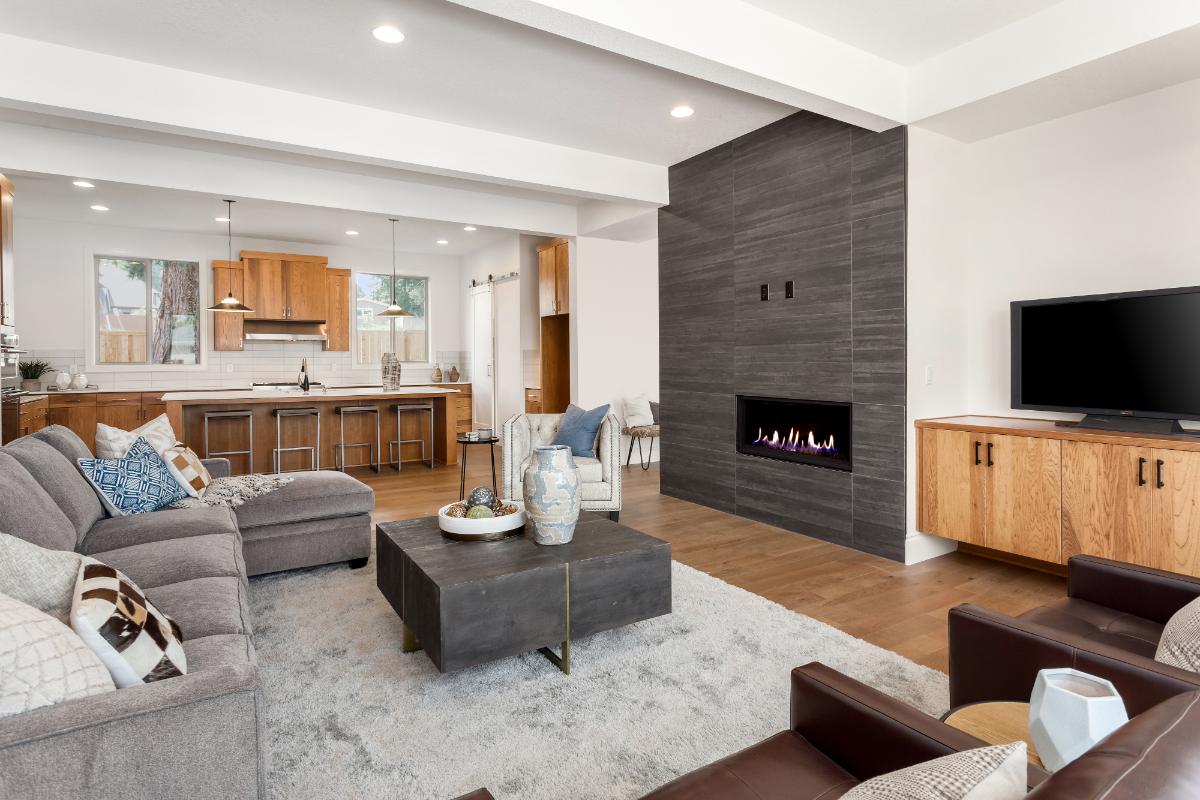 living room with fireplace and large overhead shelf 